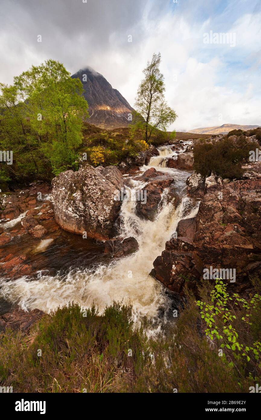 Iconic landscape Stob Dearg on Buachaille Etive Mor with waterfall on River Coupall at boundary of Glen Etive and Glen Coe in the Scottish Highlands. Stock Photo