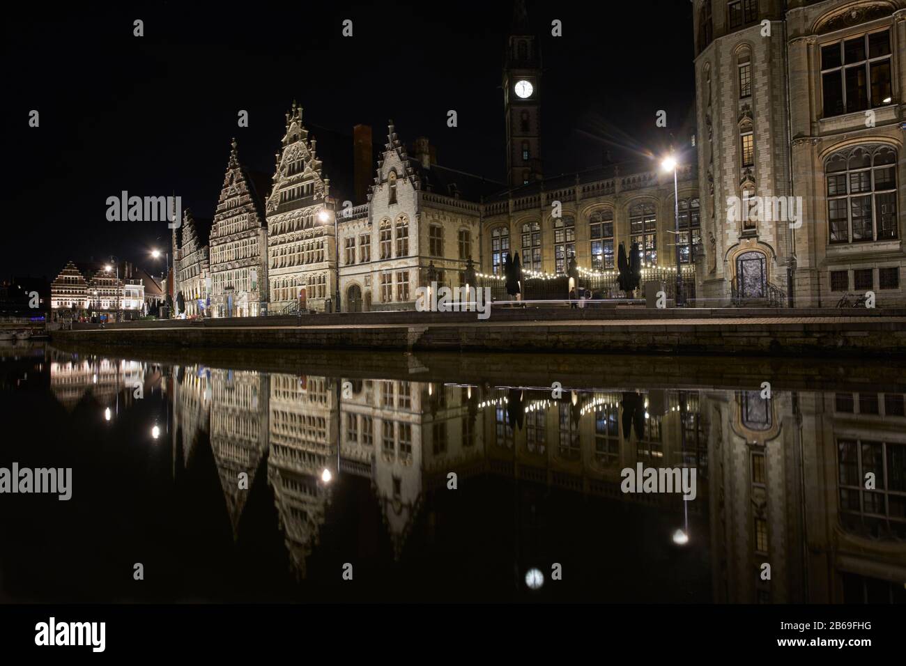 Graslei by night with reflections in River Leie Stock Photo