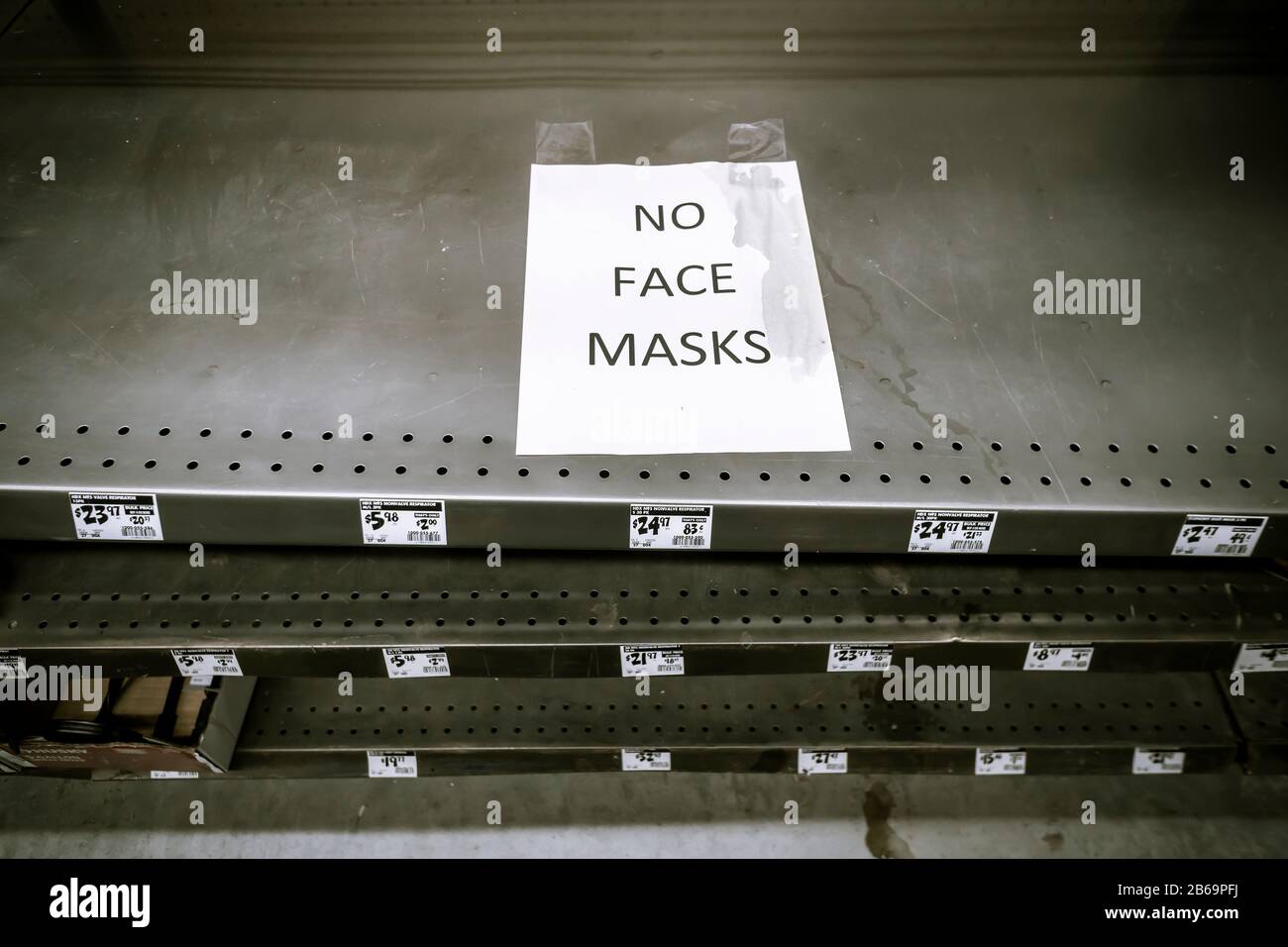 A sign in a hardware store on Thursday, February 27, 2020 in New York informs shoppers of the lack of availability of face masks and respirators. Due to concerns over the spread of the coronavirus people are buying face masks although the CDC advises that good hand washing techniques are more effective in preventing the spread of the virus. (© Richard B. Levine) Stock Photo