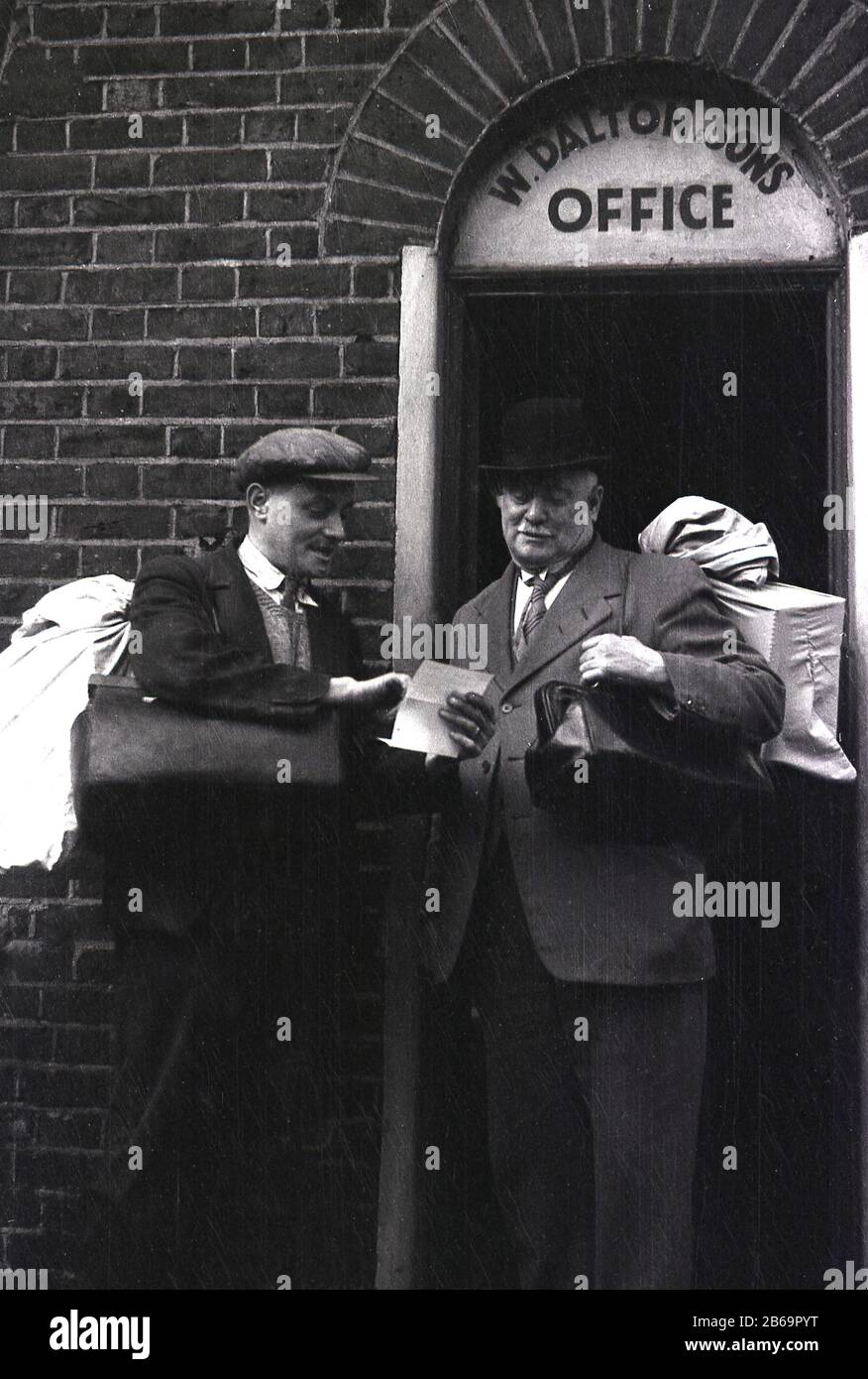 1940s, historical a rat-catcher with cloth cap and carrying a sack with