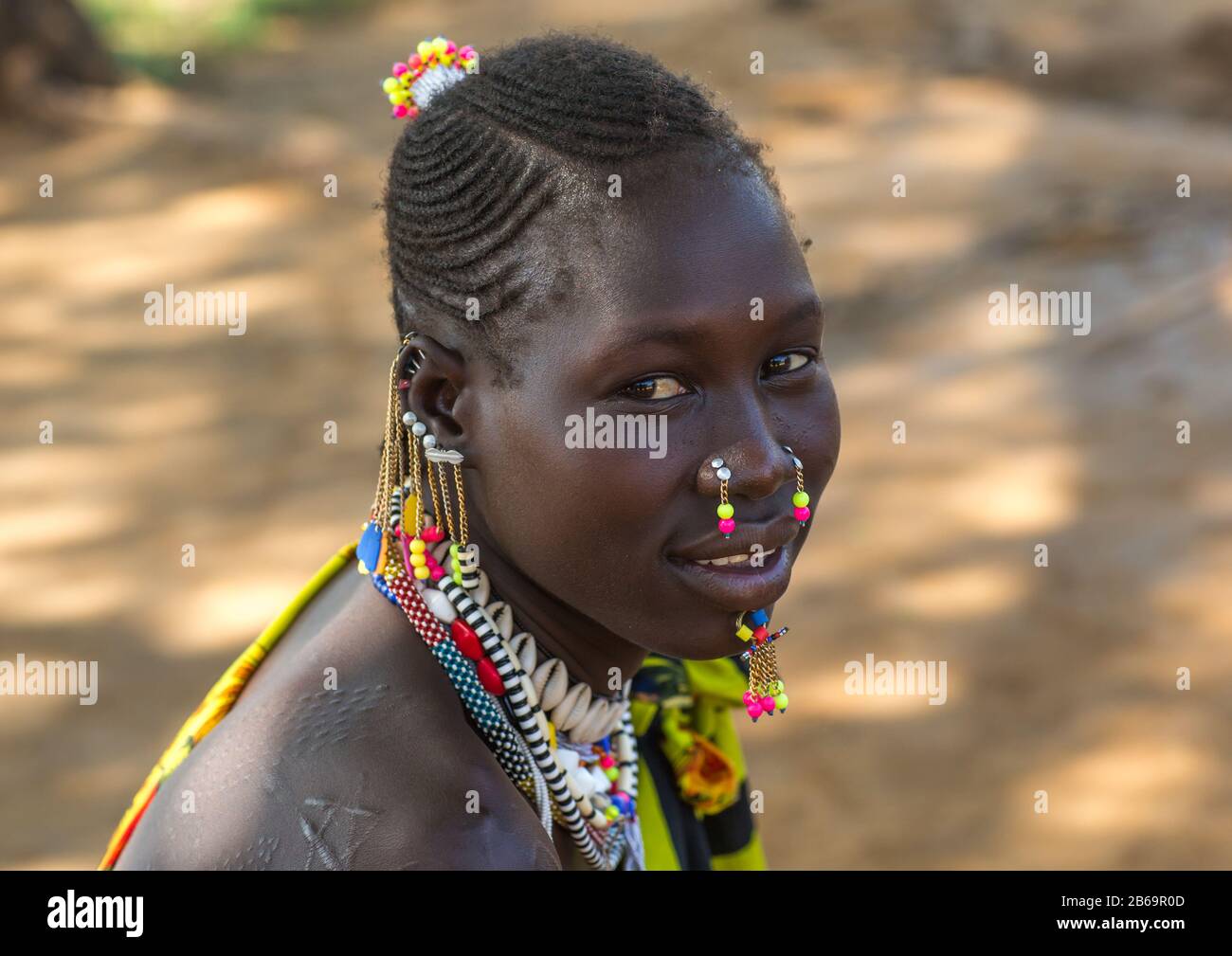 Portrait of a Larim tribe woman with traditional eaerrings and Nose earrings, Boya Mountains, Imatong, South Sudan Stock Photo
