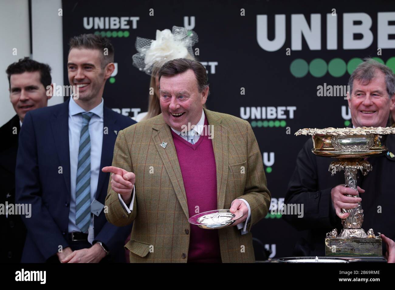 Trainer of Epatante, Nicky Henderson following victory in the Unibet Champion Hurdle Challenge Trophy on day one of the Cheltenham Festival at Cheltenham Racecourse, Cheltenham. Stock Photo