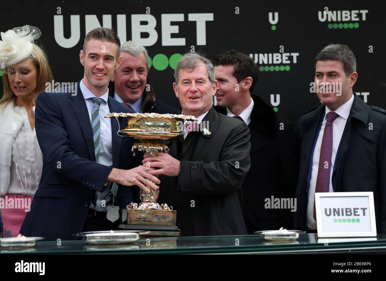 Winning owner of Epatante, J. P. McManus following victory in the Unibet Champion Hurdle Challenge Trophy on day one of the Cheltenham Festival at Cheltenham Racecourse, Cheltenham. Stock Photo