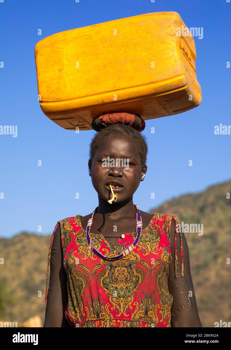 African woman carrying water drawing