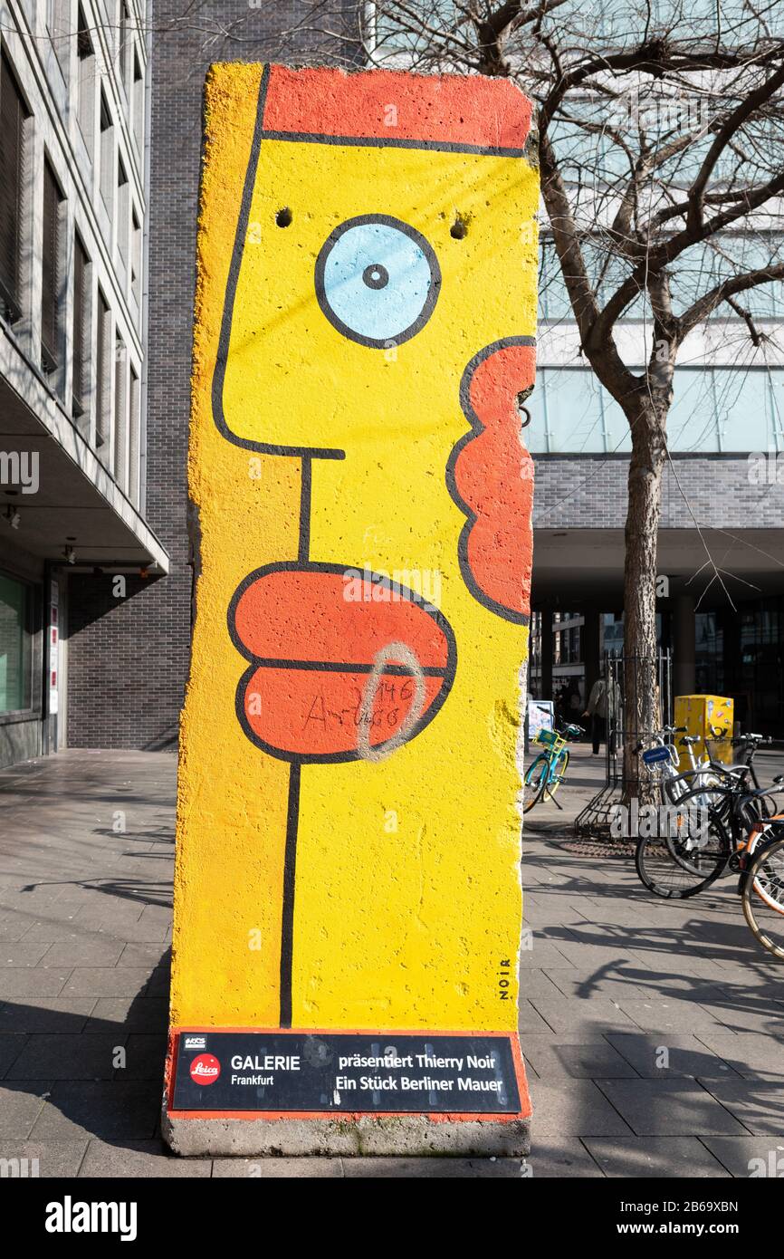 Berlin Wall segment painted by Thierry Noir, Frankfurt am Main, Germany Stock Photo