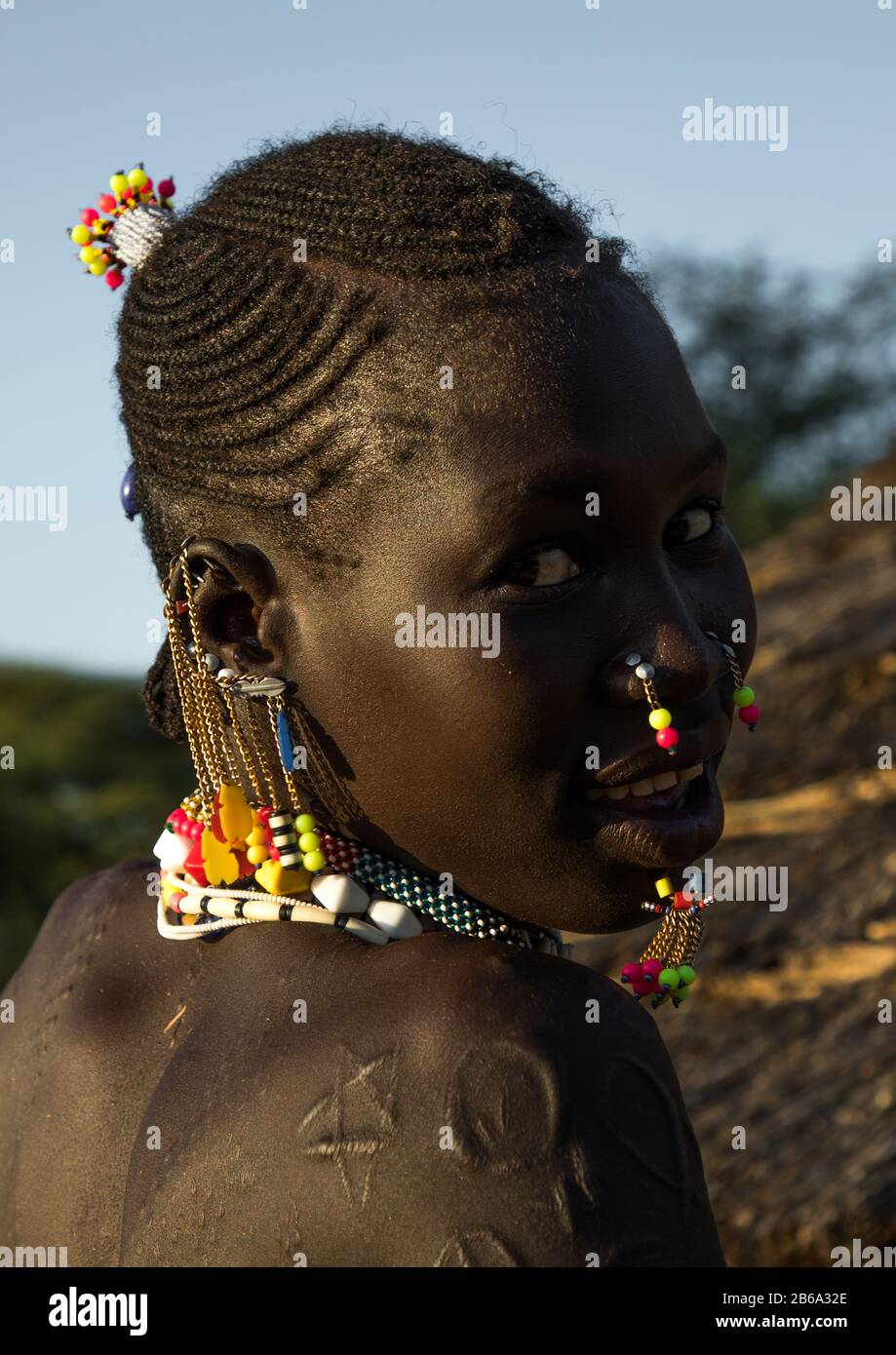 Portrait of a Larim tribe woman with traditional eaerrings, Boya Mountains, Imatong, South Sudan Stock Photo