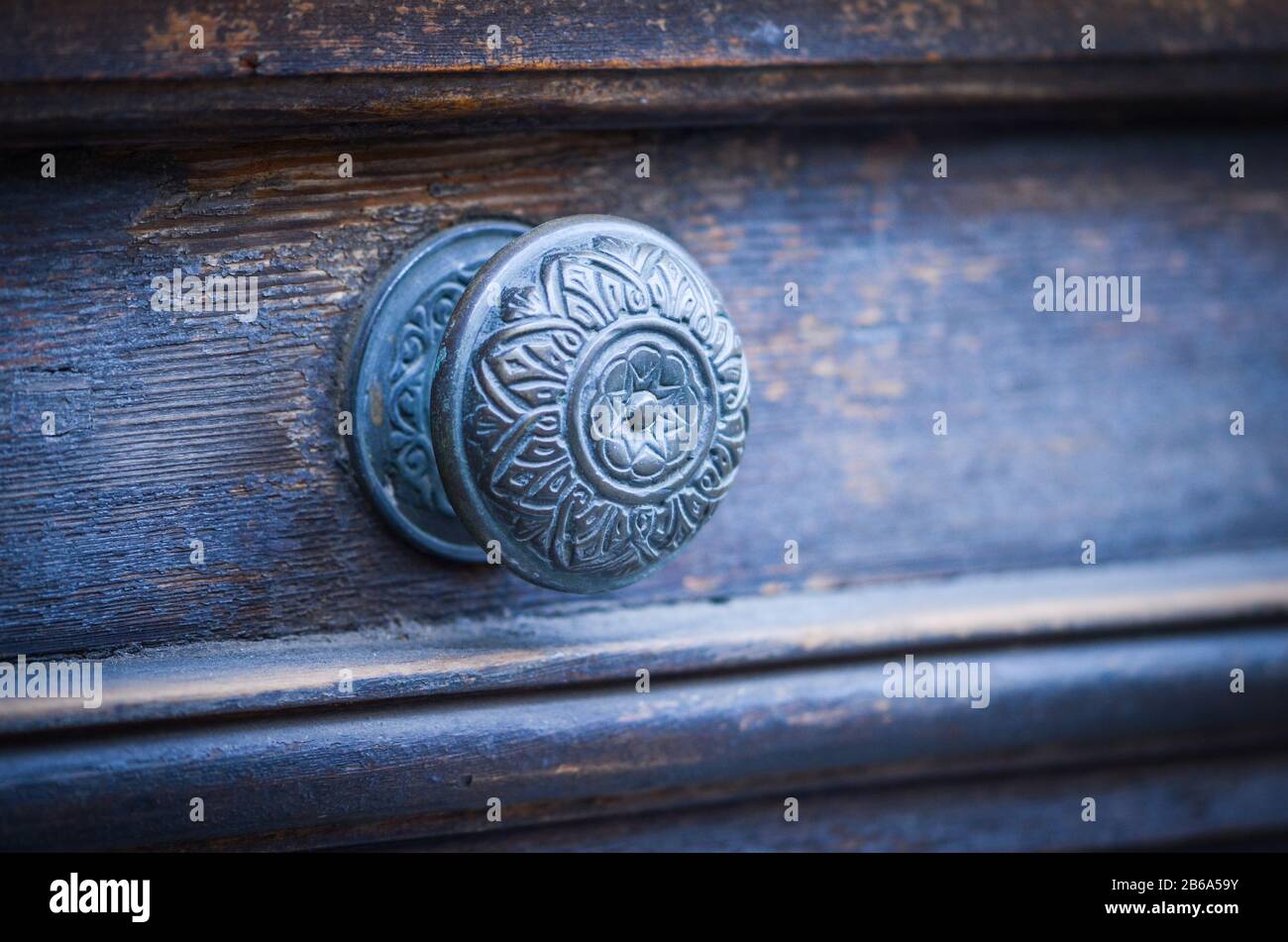 old ancient doors from wood and designed knobs Stock Photo - Alamy