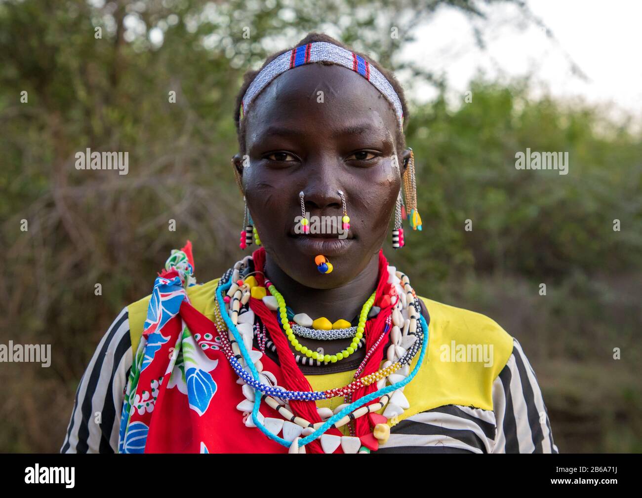 Portrait of a Larim tribe woman with traditional eaerrings and nose earrings, Boya Mountains, Imatong, South Sudan Stock Photo