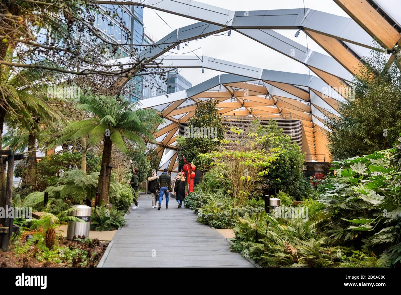 Crossrail Place Roof Garden, people walking in urban retreat and green architecture, Canary Wharf, London Stock Photo