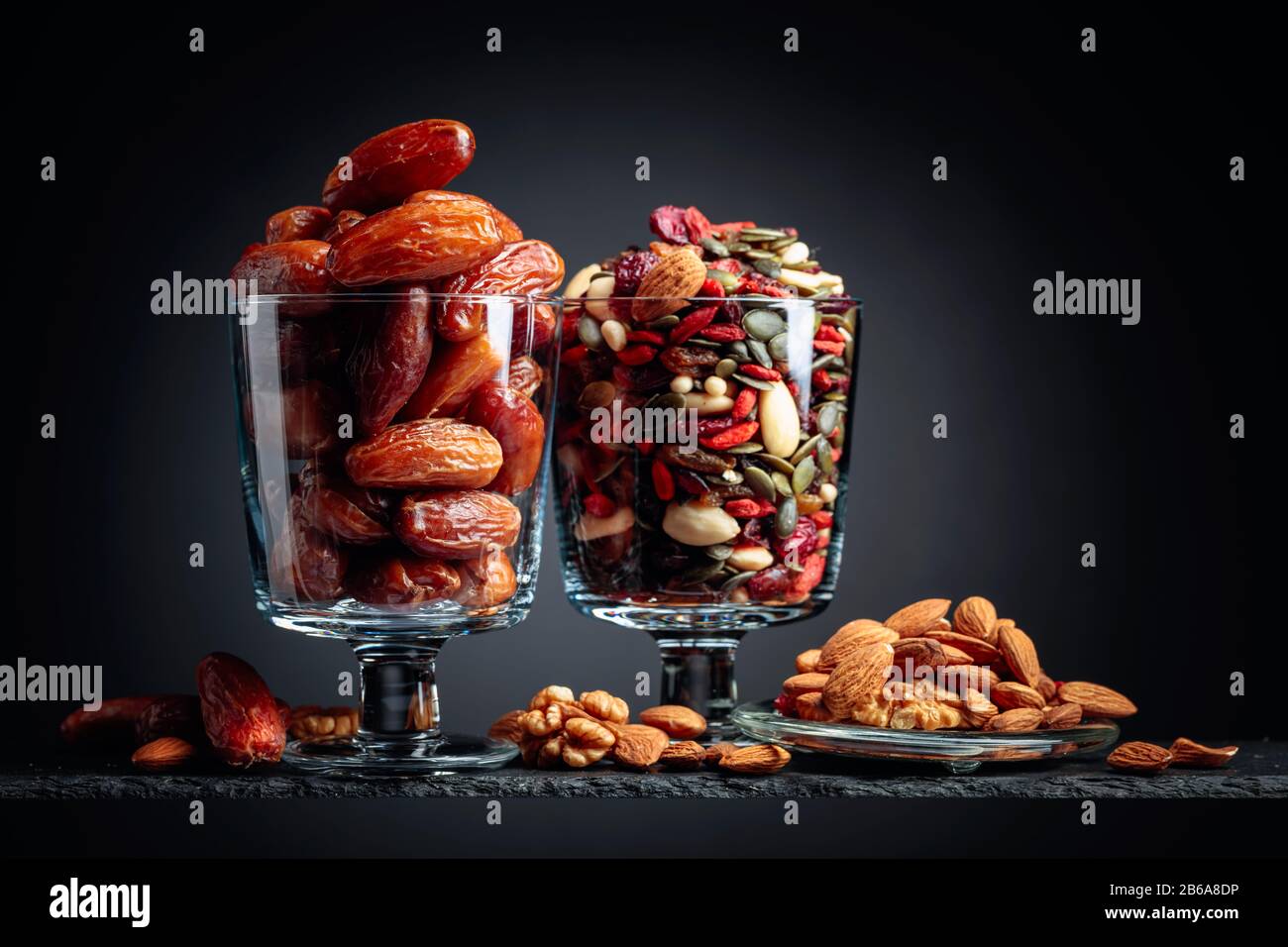 Dates and dried fruits, nuts and seeds. Copy space Stock Photo Alamy