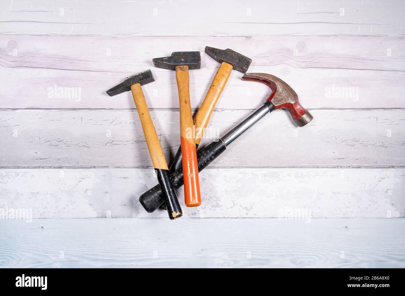 set of different types of hammers on a wooden background. top view Stock Photo Alamy