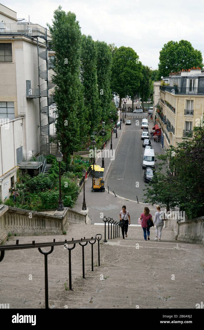 People walking on the steep Rue de la Manutention connecting River Seine and Avenue du President Wilson in 16th arrondissement.Paris.France Stock Photo