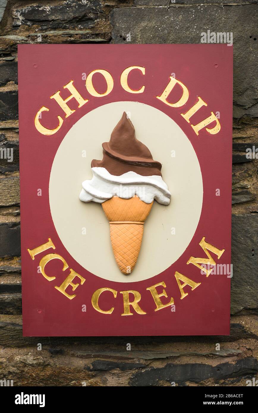Sign near Ambleside pier promoting an ice cream parlour of interest  to tourists arriving by boat on the Cumbrian lake in UK Stock Photo