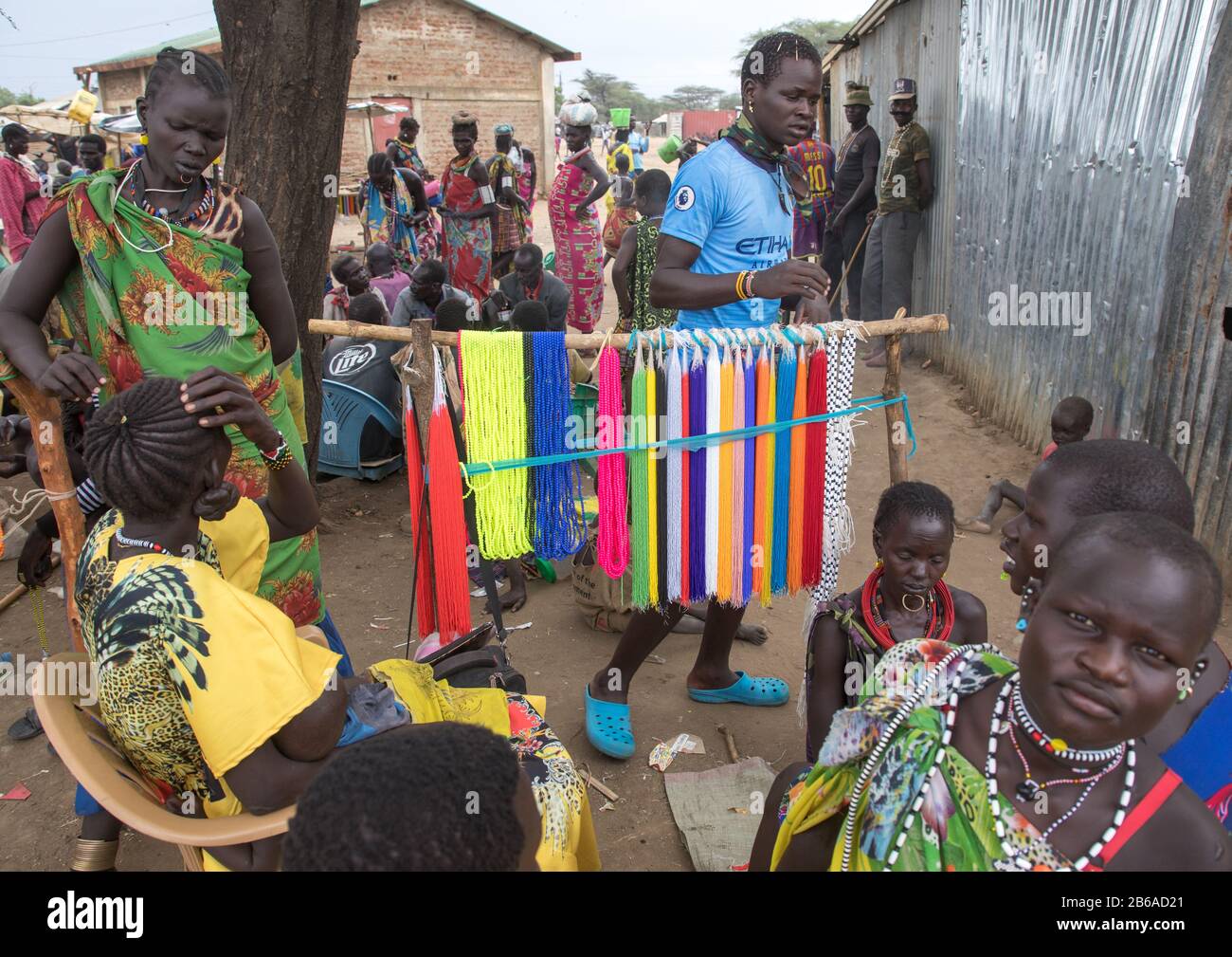 Toposa man selling beads to make necklaces in a market, Namorunyang State, Kapoeta, South Sudan Stock Photo