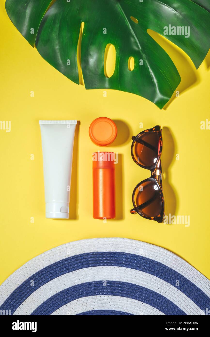 Beach accessories. Flat lay, natural cosmetics SPF for face, body Travel Concept Stock Photo