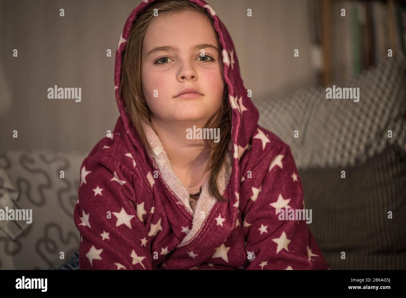 Portrait of a 10 year old girl feeling sick at home. Stock Photo