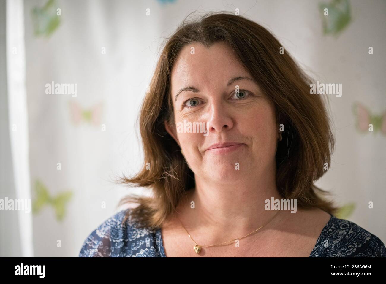 Close up portrait of a 50 year old woman with brown hair. Stock Photo