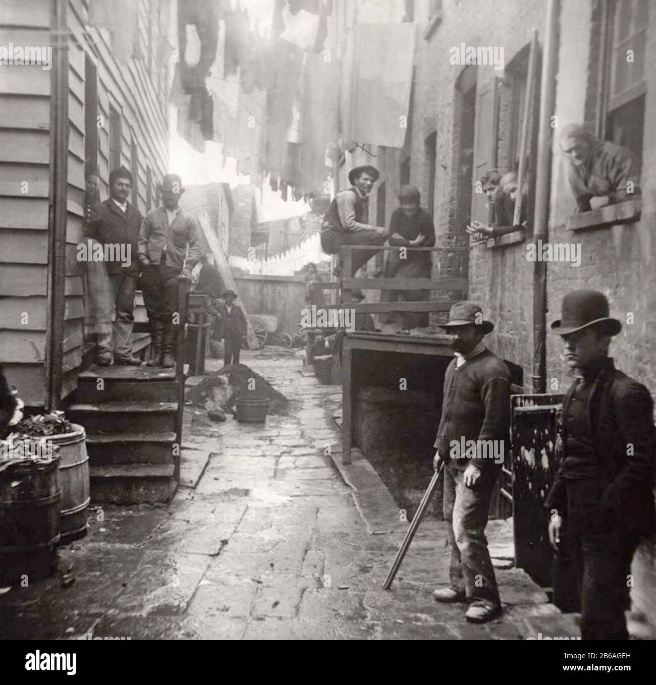 JACOB RIIS (1849-1914) Danish-American journalist, photographer and social reformer. His photo 'Bandit's Roost' at 59 1/2 Mulberrry Street,New York shows criminal gangs in one of the city's most dangerous areas. Stock Photo