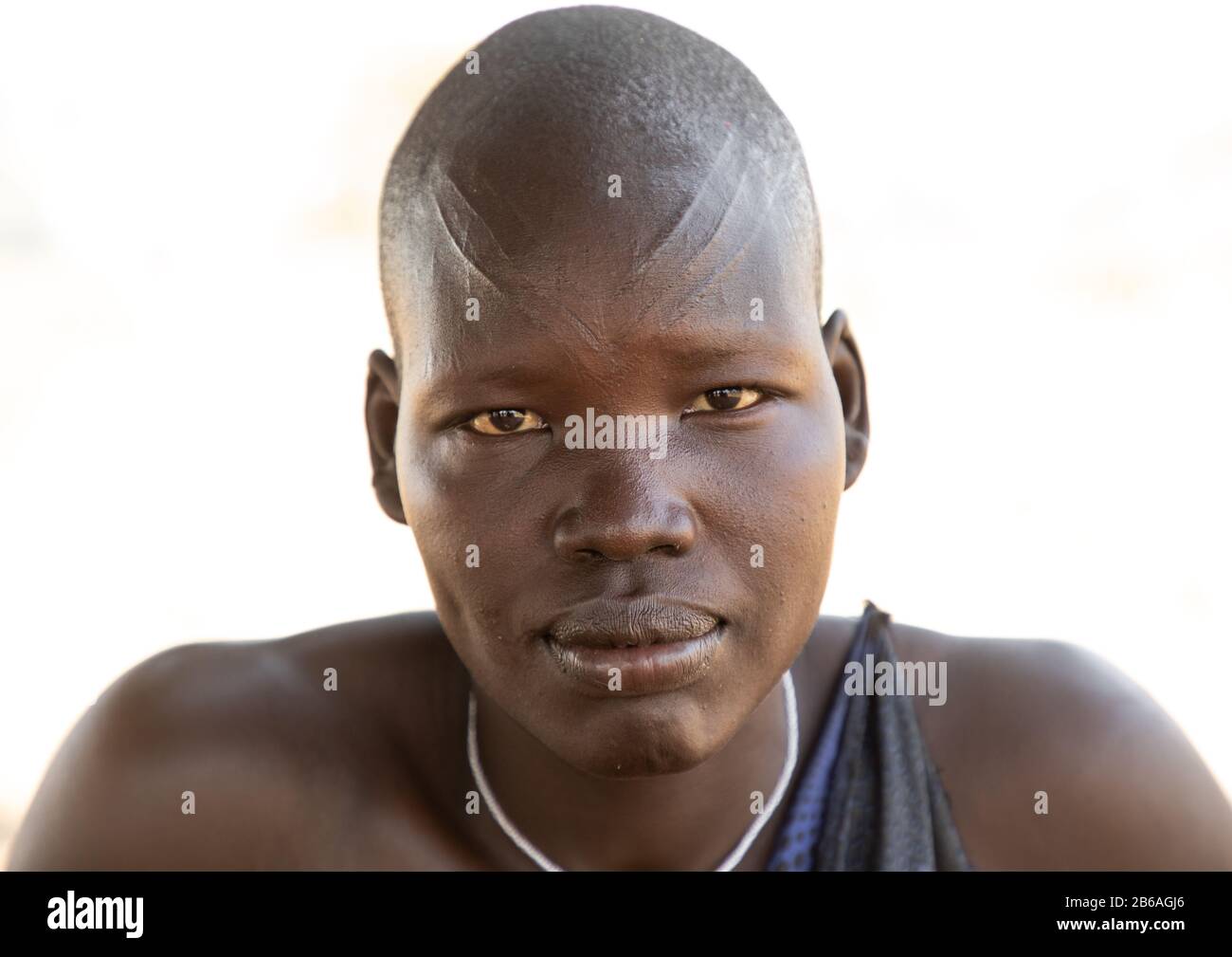 Portrait of a Mundari tribe woman with scarifications on the forehead, Central Equatoria, Terekeka, South Sudan Stock Photo