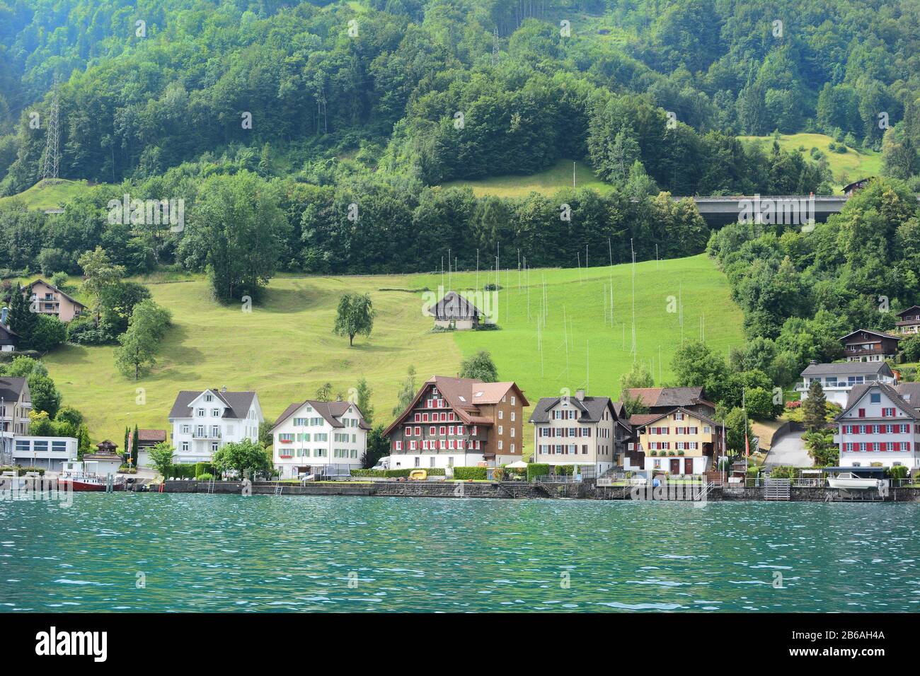 BECKENRIED, SWITZERLAND - JULY 4, 2014: Homes and Businesses in Beckenried, Beckenried is located on teh shores of Lake Lucern. Stock Photo