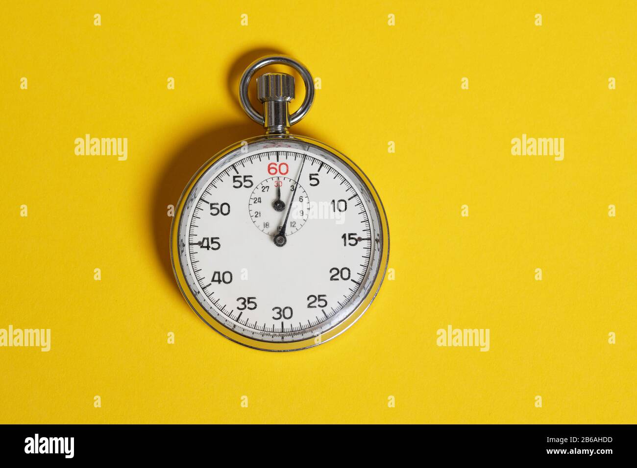 Classic stopwatch on a yellow background Stock Photo