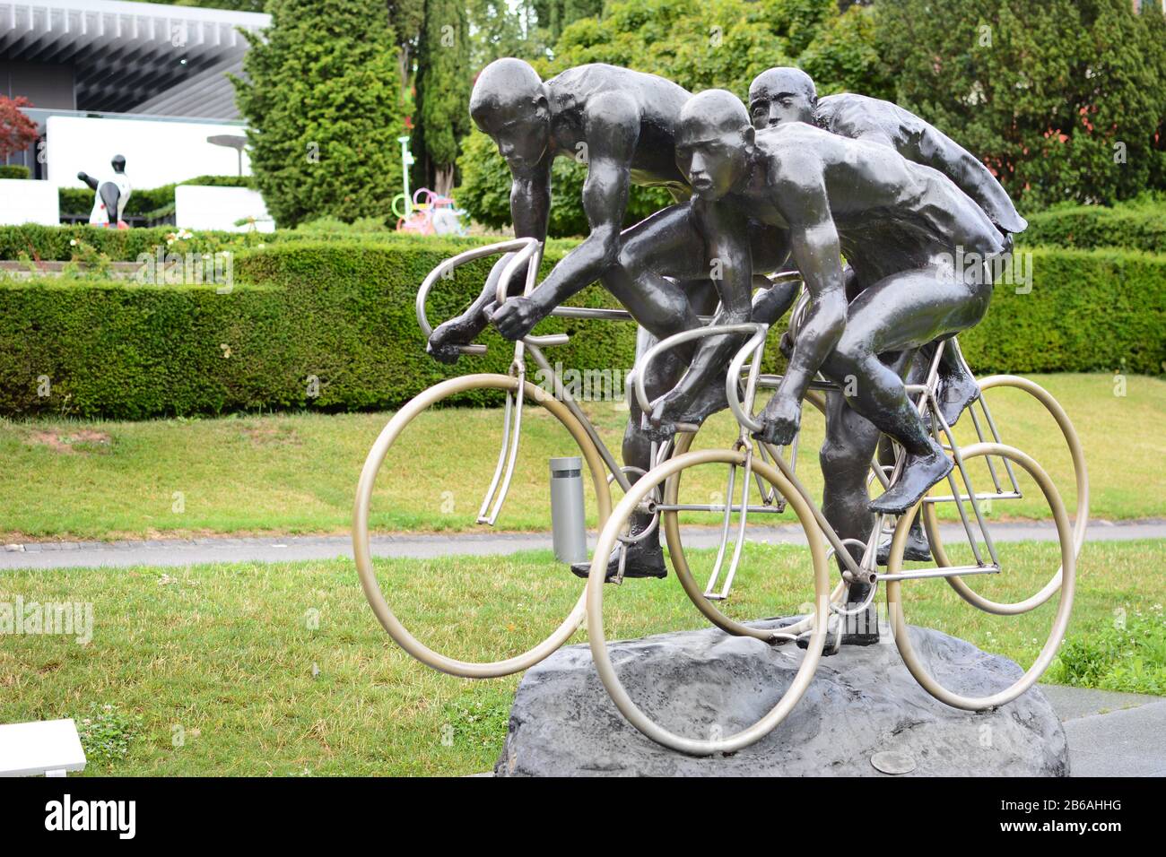 LAUSANNE, SWITZERLAND - JULY 5, 2014: Cycling Sculpture at the Olympic Museum. The Museum has more than 10,000 pieces and hosts over 250,000 visitors Stock Photo