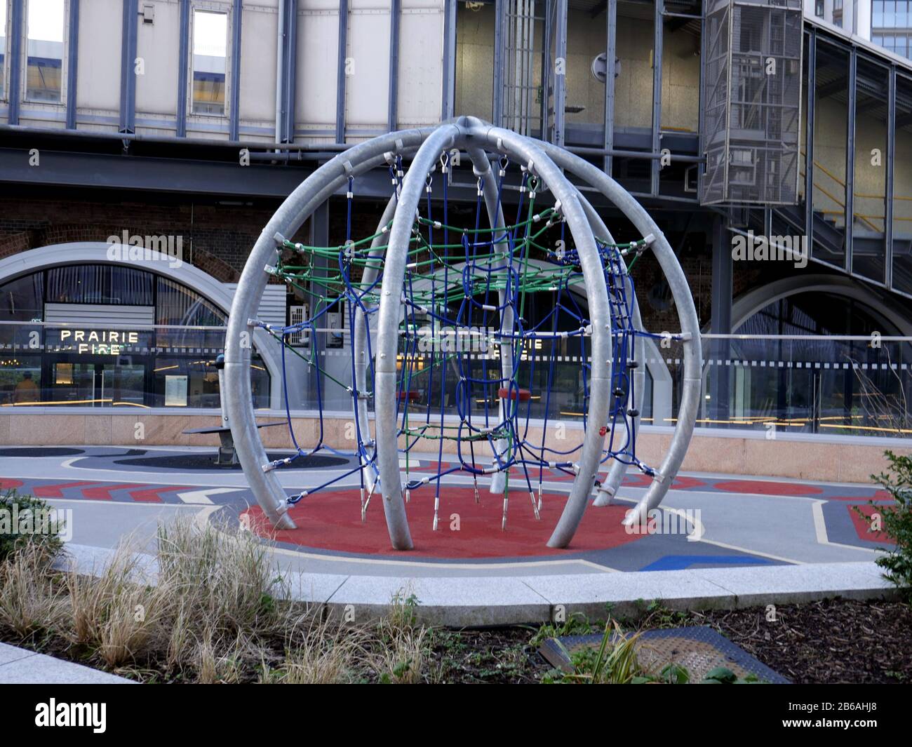 Newly installed climbing frame in a new play space outside Prairie Fire Restaurant ,Westfield, White City, London UK Stock Photo