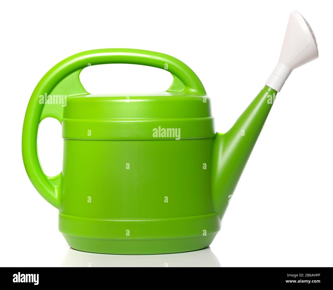 Green plastic watering can on a white background Stock Photo