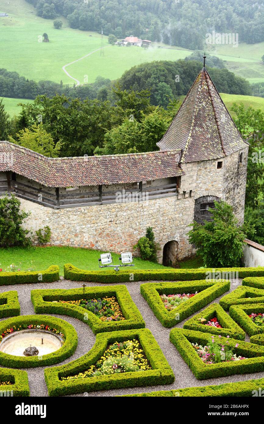GRUYERES, SWITZERLAND - JULY 8, 2014: Garden and ramparts at Gruyeres Castle. Located in the medieval town of Gruyeres and built between 1270 & 1282, Stock Photo