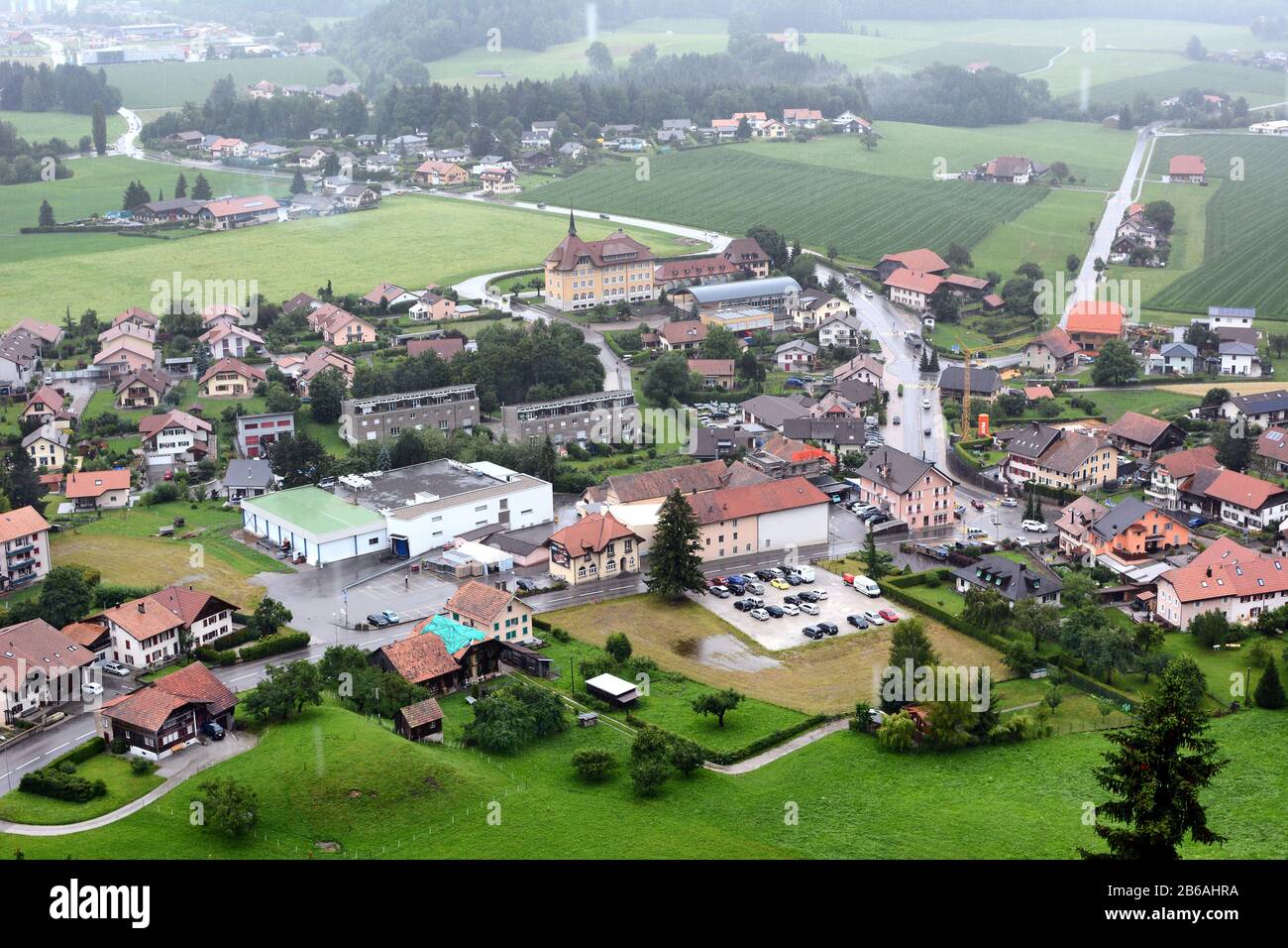 GRUYERES, SWITZERLAND - JULY 8, 2014:  The town of Gruyeres. The medieval town is an important tourist location in the upper valley of the Saane river Stock Photo