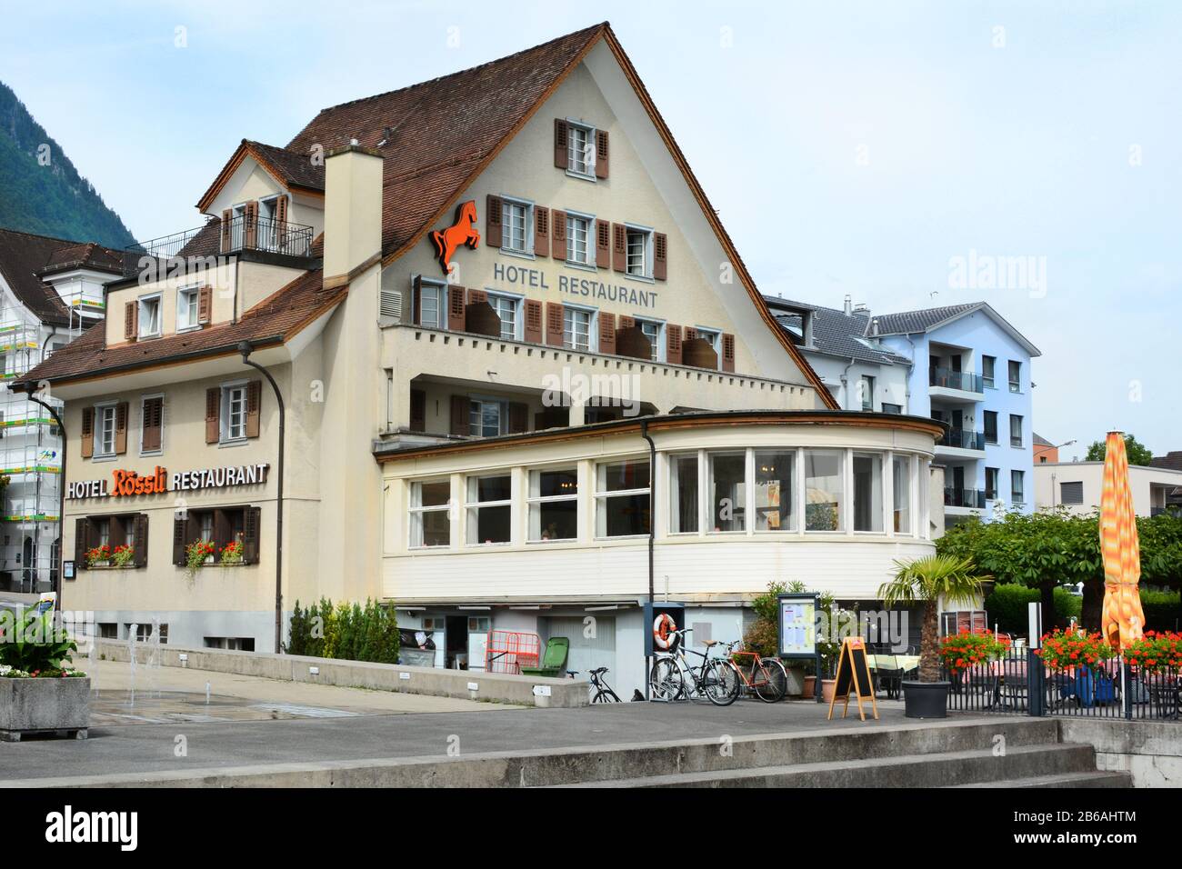 BECKENRIED, SWITZERLAND - JULY 4, 2014: Hotel Roessli. The hotel is located on the shores of Lake Lucern. Stock Photo