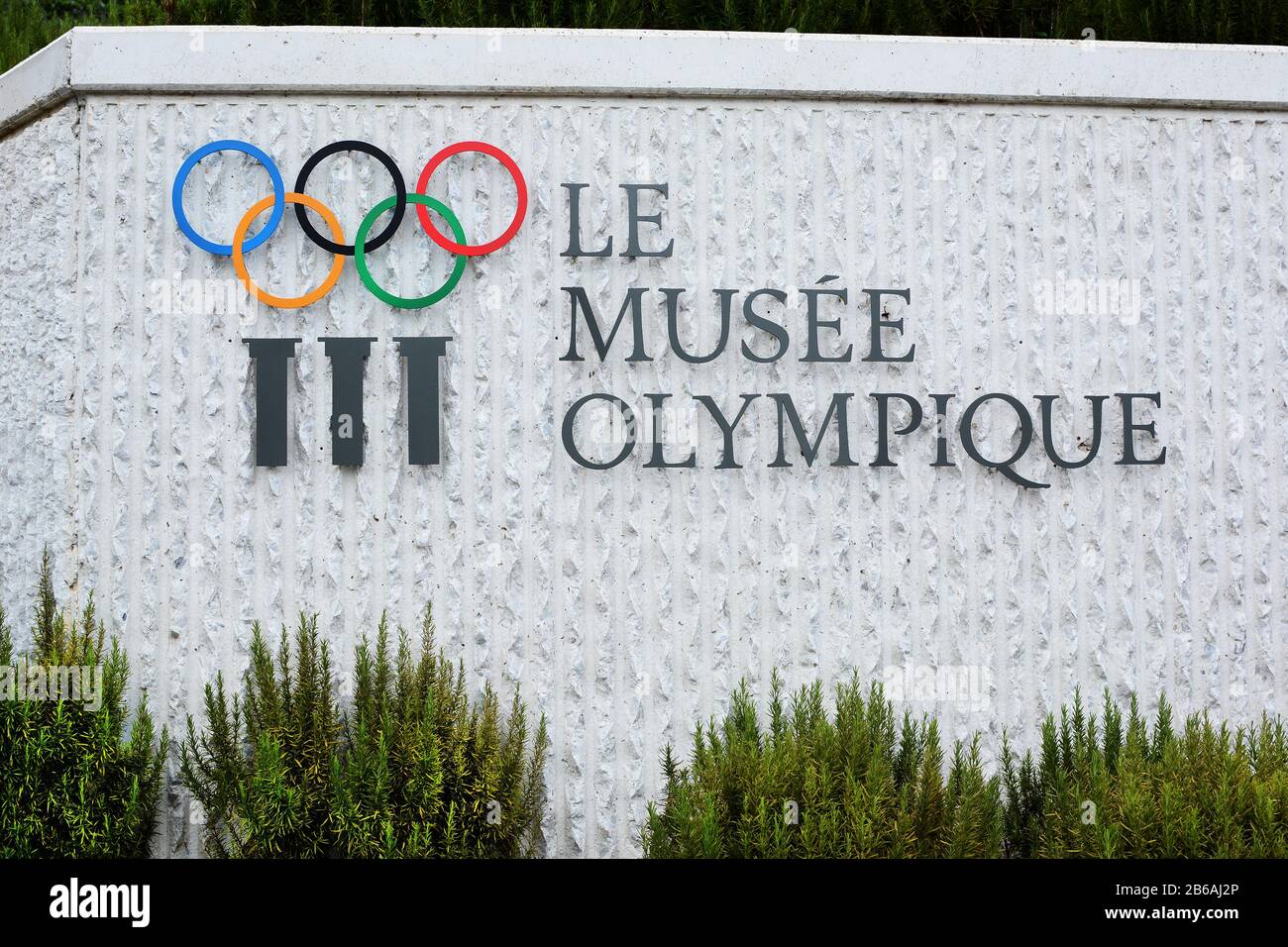 LAUSANNE, SWITZERLAND - JULY 5, 2014: Fountain and Sign at the Olympic Museum. The Museum has more than 10,000 pieces and hosts over 250,000 visitors Stock Photo