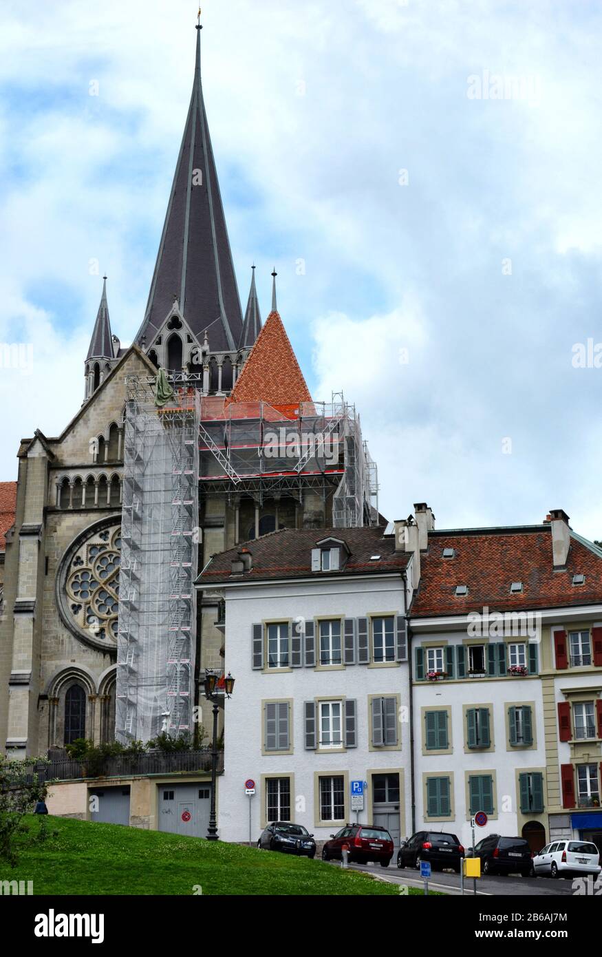 LAUSANNE, SWITZERLAND - JULY 7, 2014: The Cathedral of Notre Dame of Lausanne. The Cathedral is currently undergoing renovation and is partially cover Stock Photo