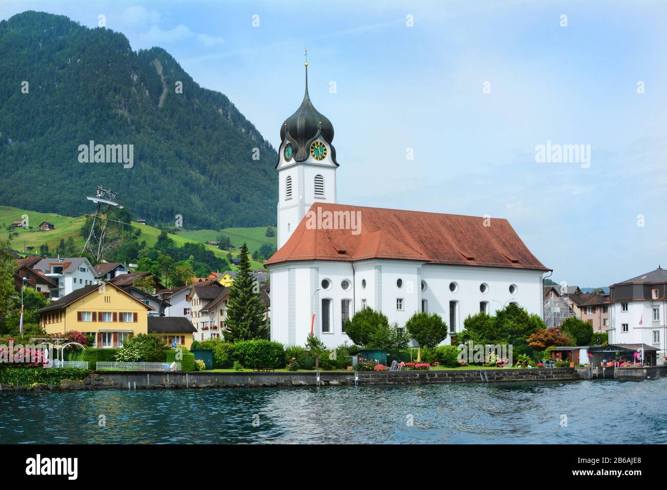 BECKENRIED, SWITZERLAND - JULY 4, 2014: St. Heinrich Church in Beckenried on the banks of  Lake Lucerne. Beckenried is a town in the canton of Nidwald Stock Photo