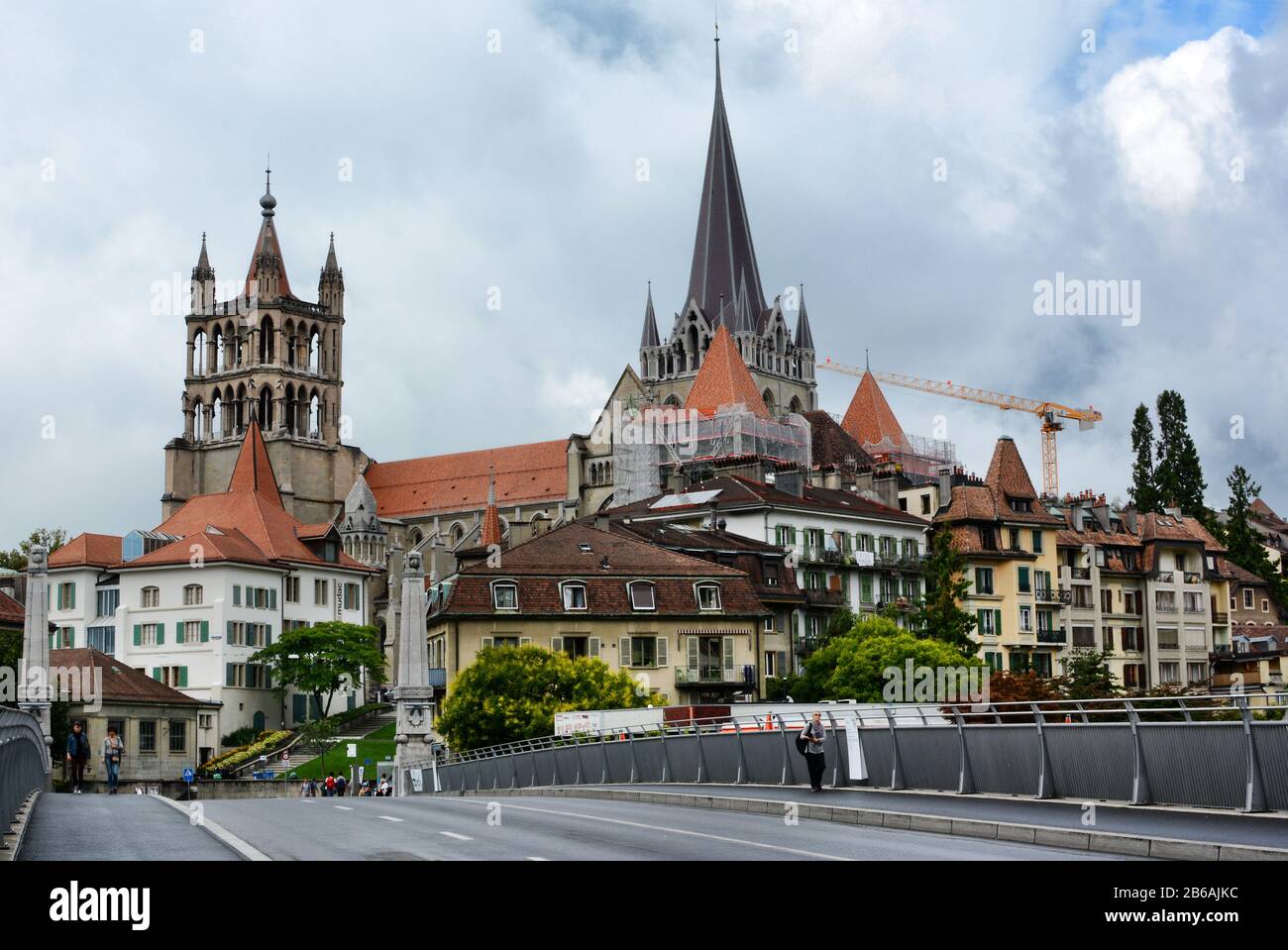 LAUSANNE, SWITZERLAND - JULY 7, 2014: The Cathedral of Notre Dame of Lausanne rises above the city. The Cathedral is currently undergoing renovation a Stock Photo