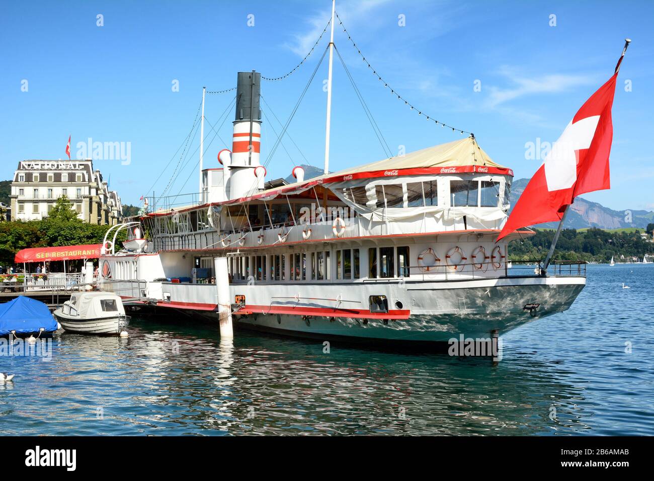 LUCERNE, SWITZERLAND - JULY 3, 2014: The Wilhelm Tell Restaurant. On Lake Lucerne the century old paddle steamer is permanently anchored and a first c Stock Photo