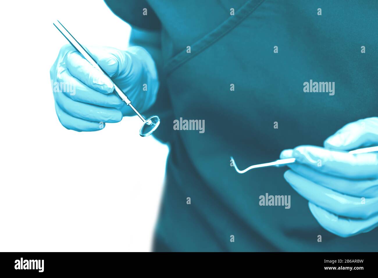 In the office of the dental clinic. The doctor holds tools for ...