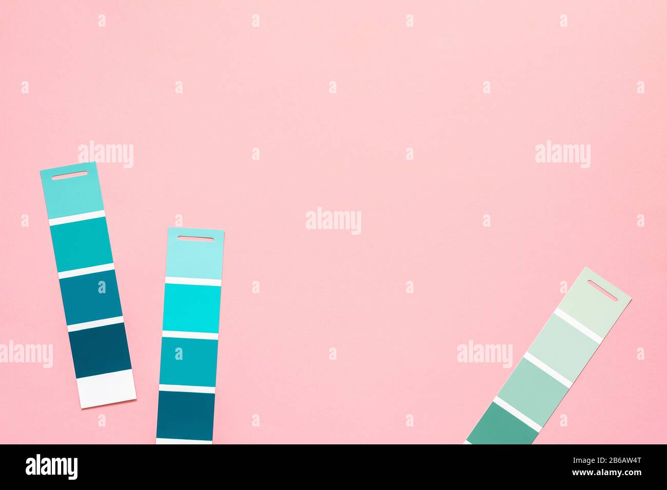 Selection of palette for painting, sample color catalog on a pink