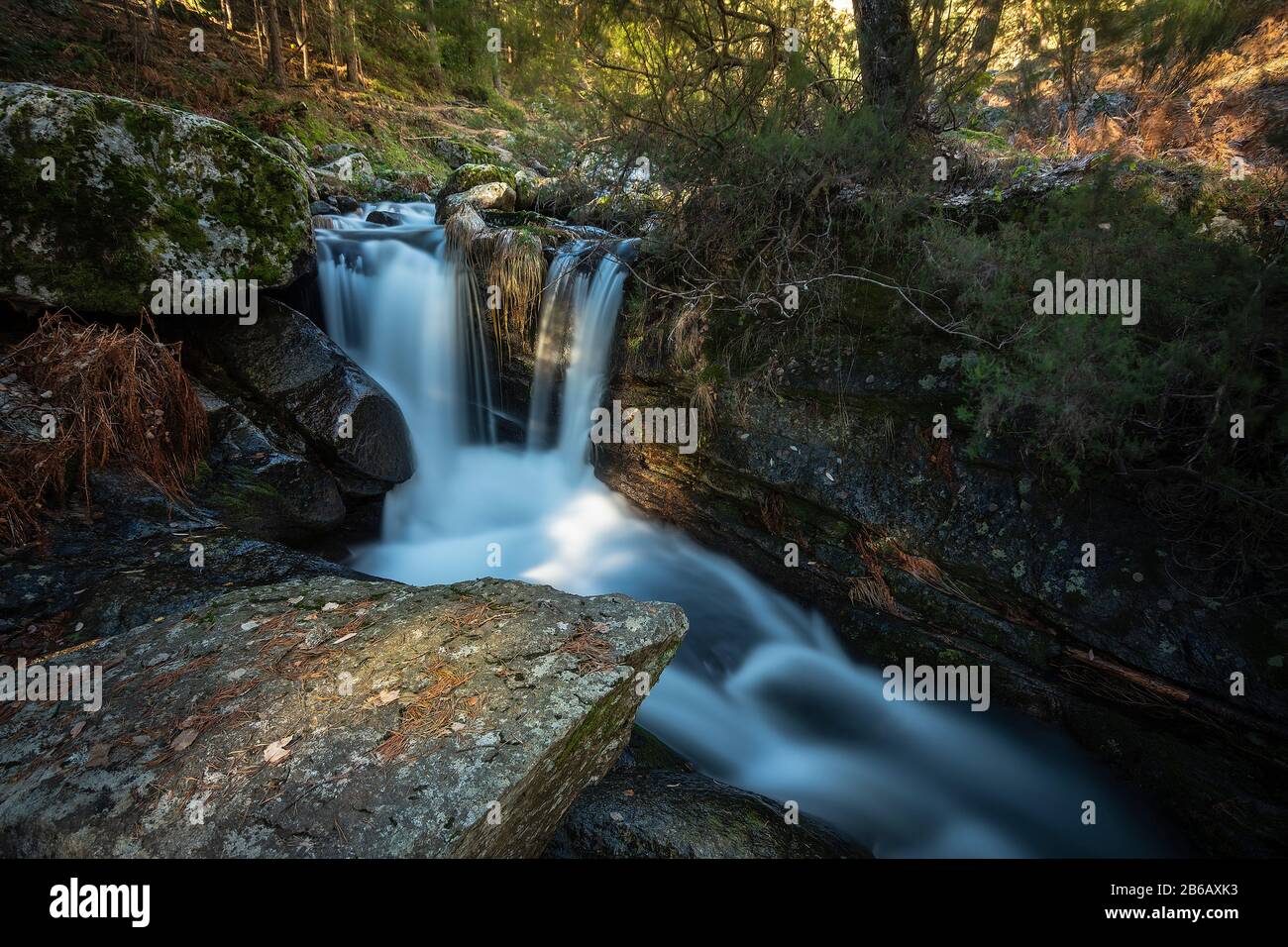 Waterfall between rocks Stock Photo