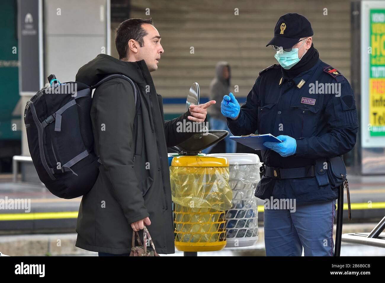 Turin, Italy. 09th Mar, 2020. TURIN, ITALY - March 09, 2020: Police officer checks a passenger leaving from Turin Porta Nuova train station. The Italian government imposed a virtual lockdown on the north of the country as part of measures to stop the spread of the coronavirus COVID-19 outbreak in Italy. (Photo by Nicolò Campo/Sipa USA) Credit: Sipa USA/Alamy Live News Stock Photo