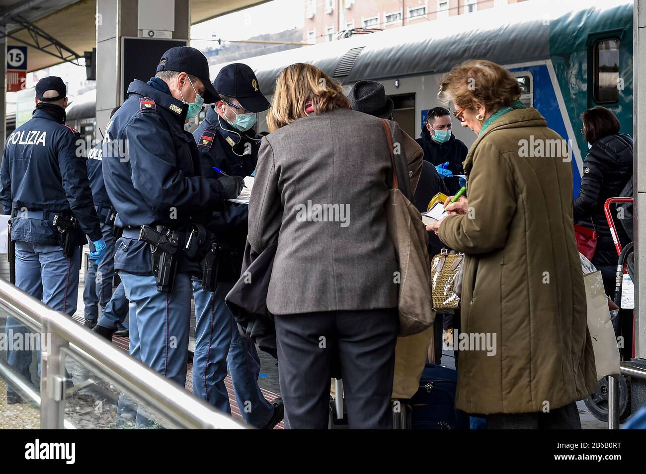 Turin, Italy. 09th Mar, 2020. TURIN, ITALY - March 09, 2020: Police officers check passengers leaving from Turin Porta Nuova train station. The Italian government imposed a virtual lockdown on the north of the country as part of measures to stop the spread of the coronavirus COVID-19 outbreak in Italy. (Photo by Nicolò Campo/Sipa USA) Credit: Sipa USA/Alamy Live News Stock Photo
