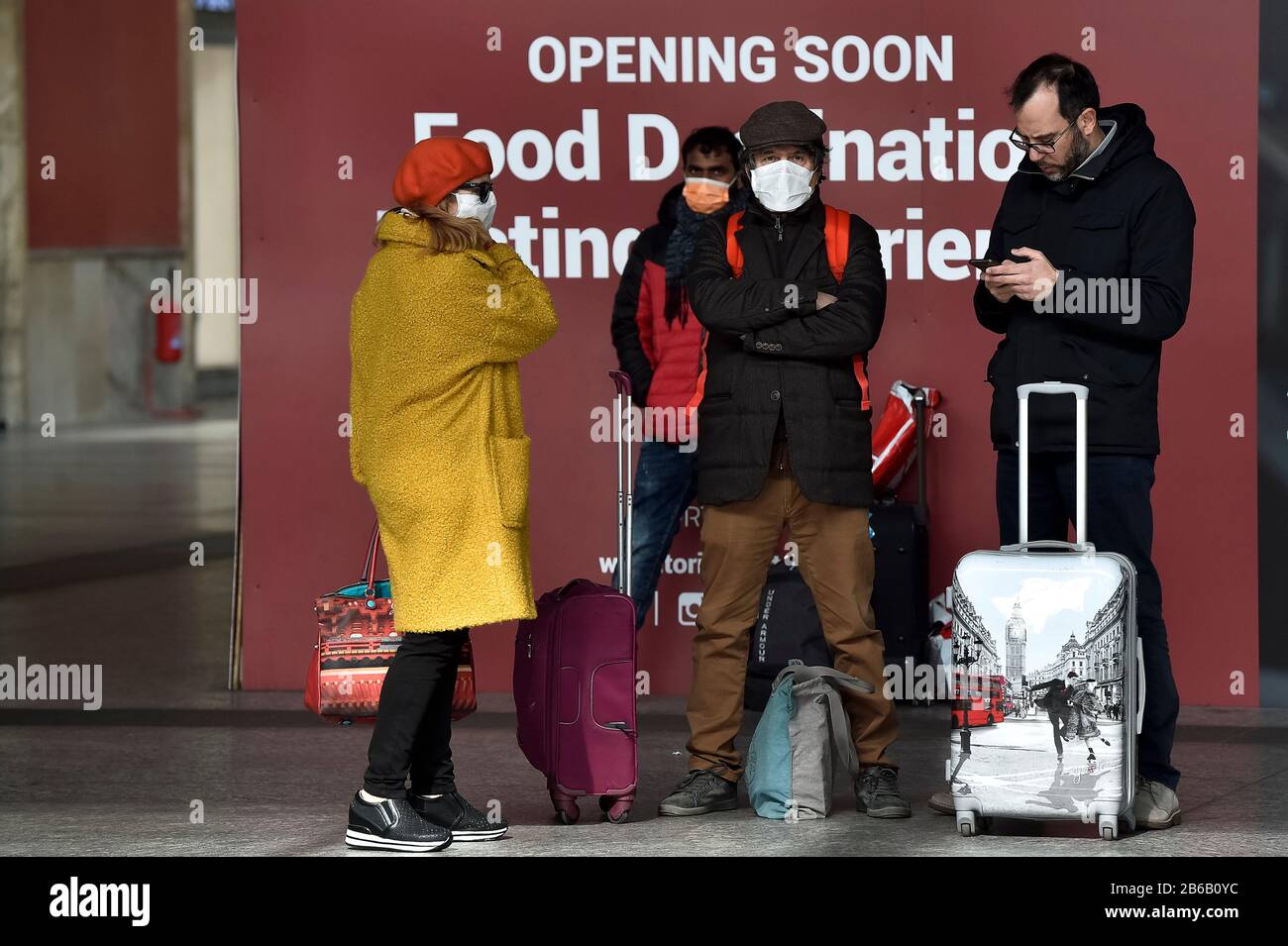 Turin, Italy. 09th Mar, 2020. TURIN, ITALY - March 09, 2020: Passengers with their bags wait in Turin Porta Nuova train station. The Italian government imposed a virtual lockdown on the north of the country as part of measures to stop the spread of the coronavirus COVID-19 outbreak in Italy. (Photo by Nicolò Campo/Sipa USA) Credit: Sipa USA/Alamy Live News Stock Photo