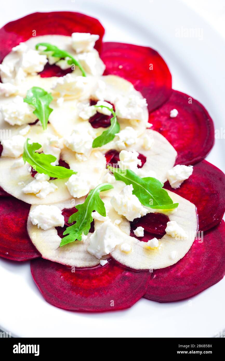 fresh beetroot and apple salad with fresh goat cheese and arugula Stock Photo