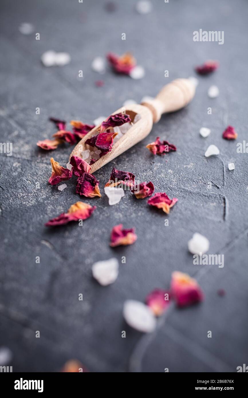Bath salt with pink dried rose petals Stock Photo Alamy