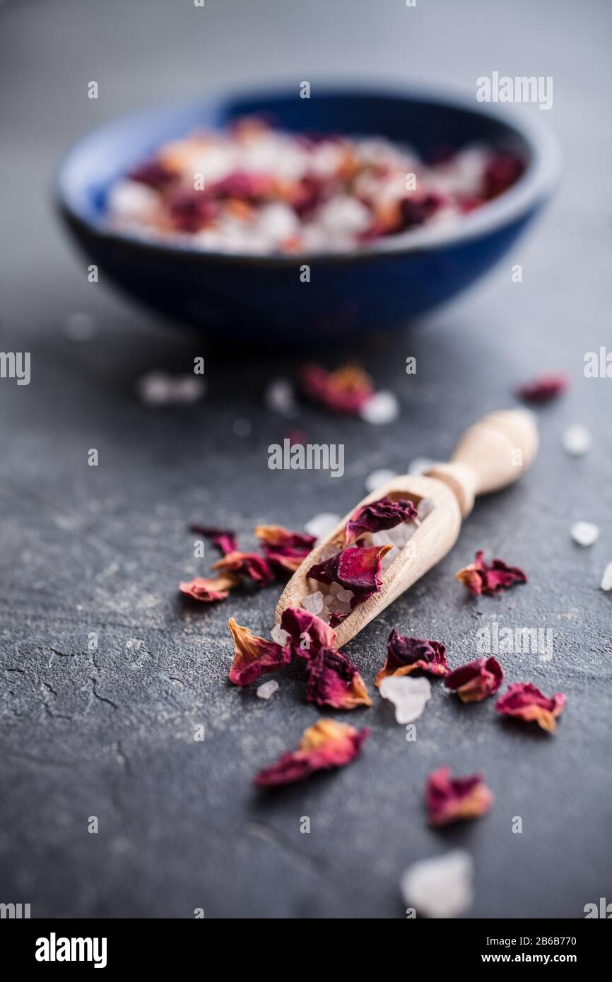 Bath salt with pink dried rose petals Stock Photo Alamy