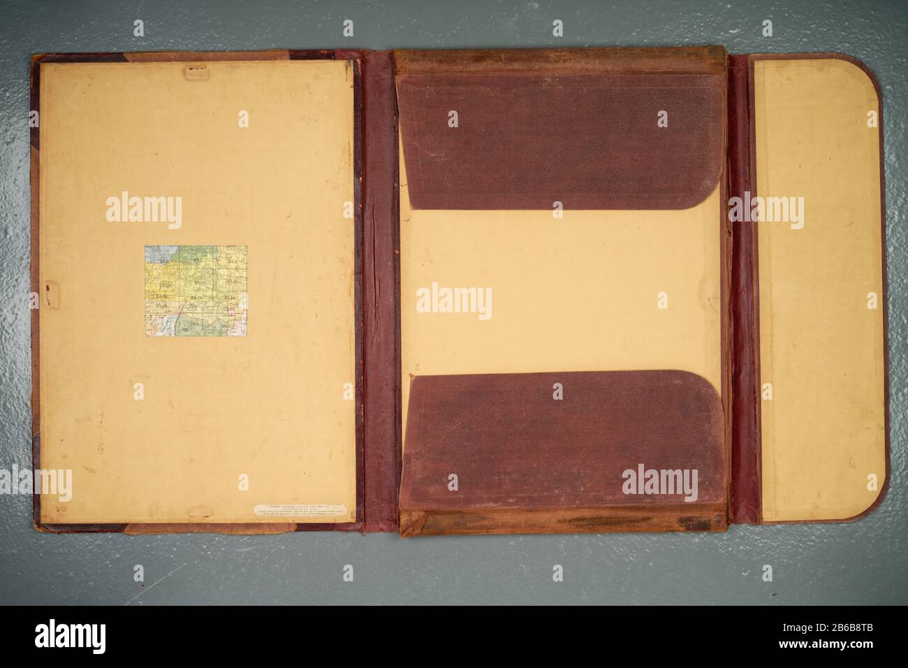 Old folding storage folder for a portfolio of say, paper prints/maps/designs. Stock Photo