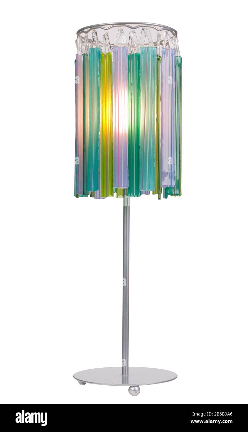 A multicoloured glass shade of a table lamp. Stock Photo