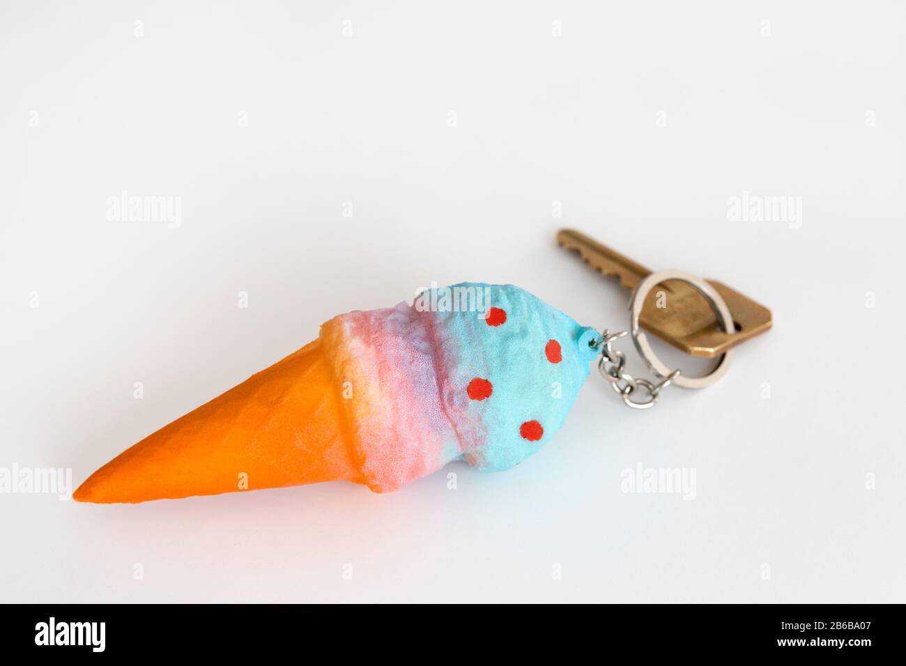 squishy ice cream keychain with key on white background Stock Photo