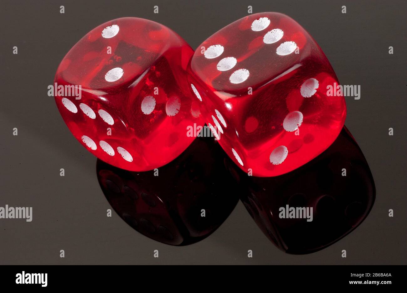 Red Dice. Throwing dice with spots of one to six on its sides Stock