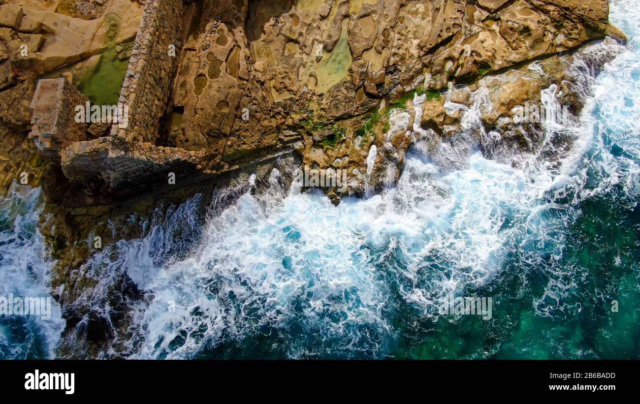 Wild Ocean water from above - Waves hitting the rocks Stock Photo - Alamy